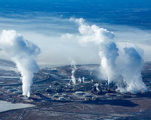 Billows of steam from upgraders at the Mildred Lake facility. Photo by Alex S MacLean.