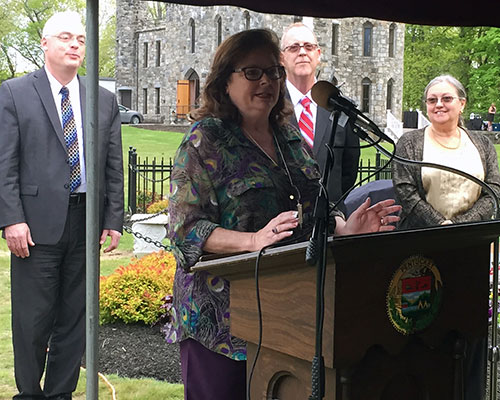 Donna Robinson discusses the passions of her cousin, the late Dorothy M. McClennan, as Haverhill City Council President John A. Michitson, city Councilor Thomas J. Sullivan, and Grace Marcoux of the Winnekenni Foundation, look on.
