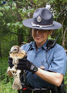Massachusetts State Police Trooper Leigha Genduso holds the emaciated bird. (Courtesy photograph.)