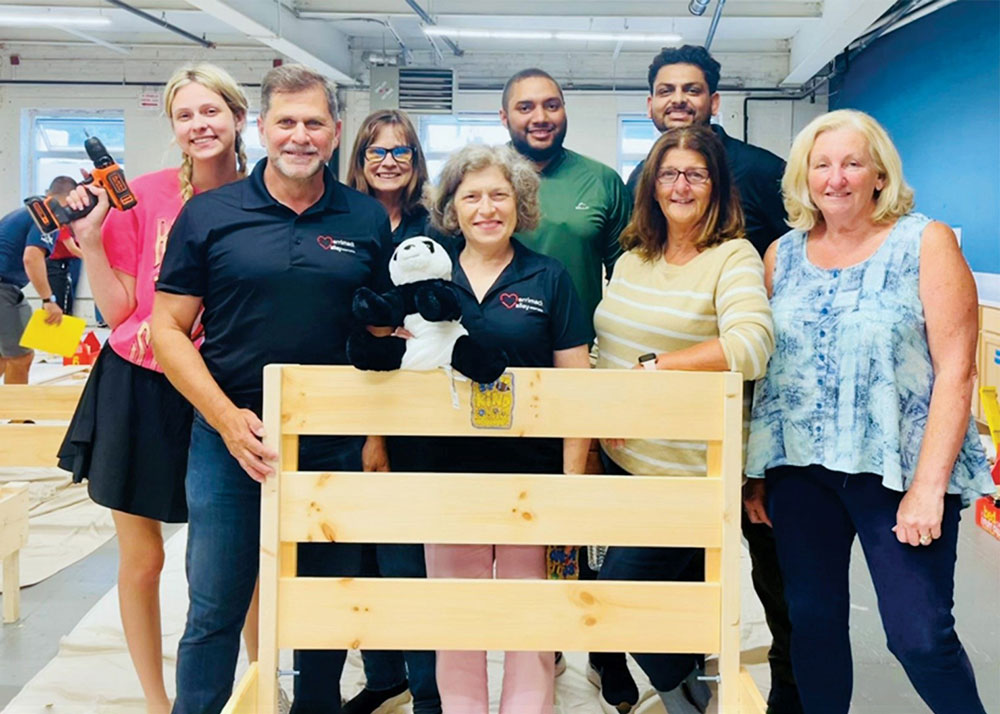 Merrimack Valley Credit Union Team Builds Children’s Beds For Lynn-Based A Bed for Every Child